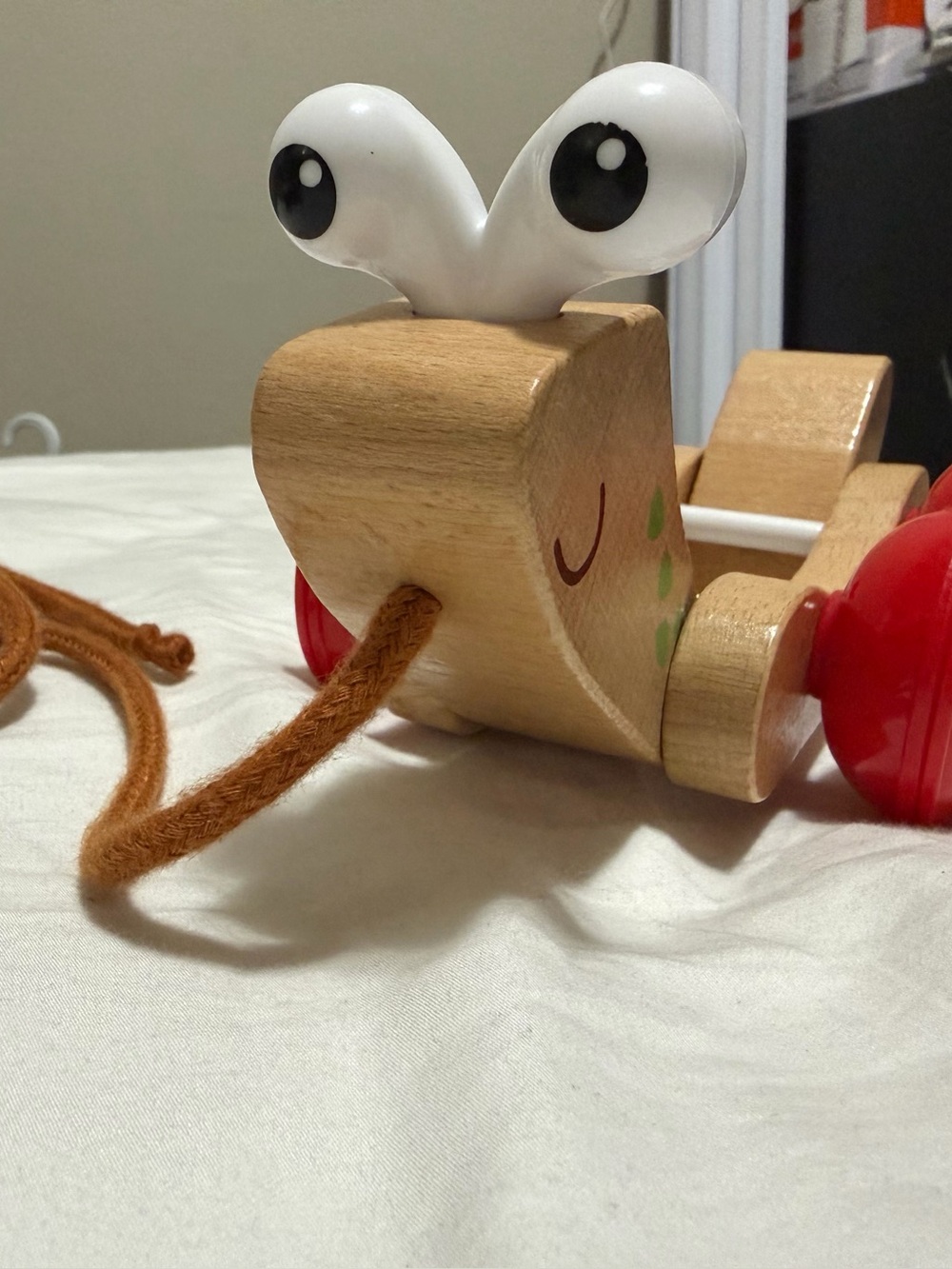 Wooden Pull-Along Snail Toy — Natural Wood with Red Wheels